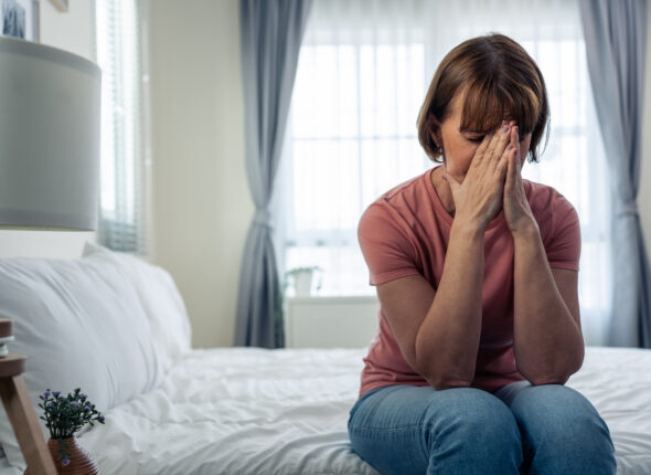 woman-in-distress-sitting-on-bed-at-home-2026-03-24-23-12-37-utc